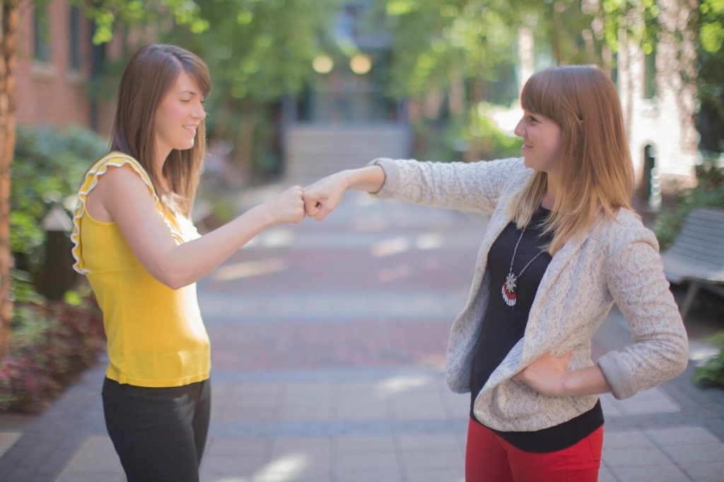 product-managers-vs.-project-managers3 Women fist bumping each other