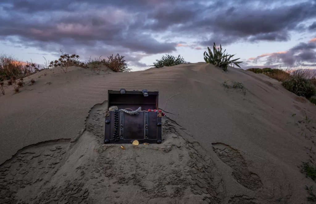 Treasure,Chest,At,The,Beach,In,A,Sunrise,,Jewels,And treasure chest at the beach in a sunrise, jewels and gold coins