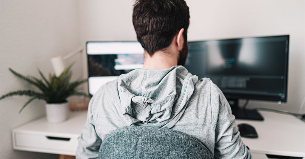 craft.io Working Remotely Man working remotely from home with 2 monitors