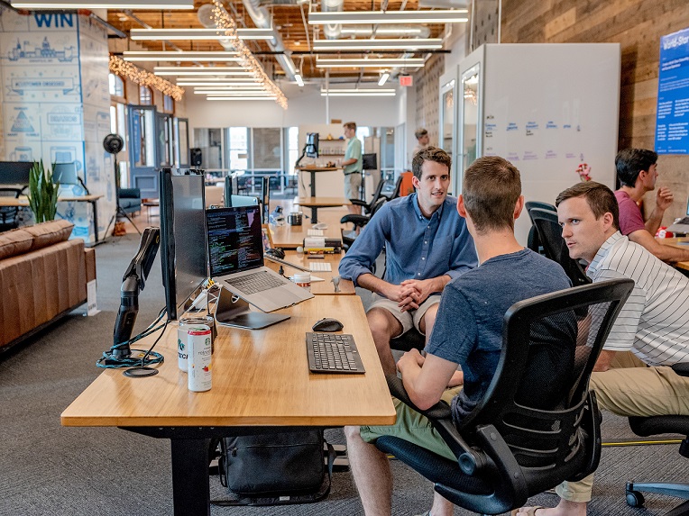 austin-distel-mpN7xjKQ_Ns-unsplash People in a meeting in Austin