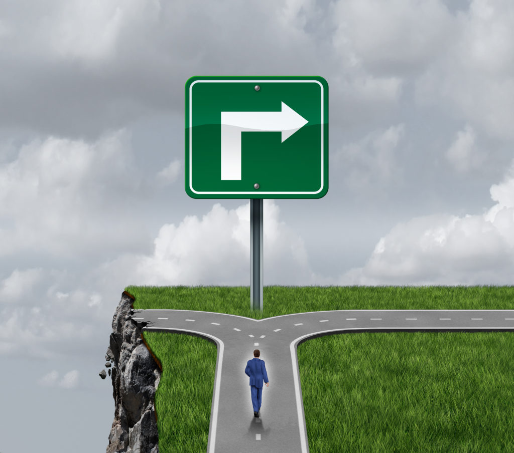 Business,Consulting,Concept,As,A,Businessman,At,A,Crossroad,With Right turn sign on the edge of a cliff and a man is walking on the road towards the sign
