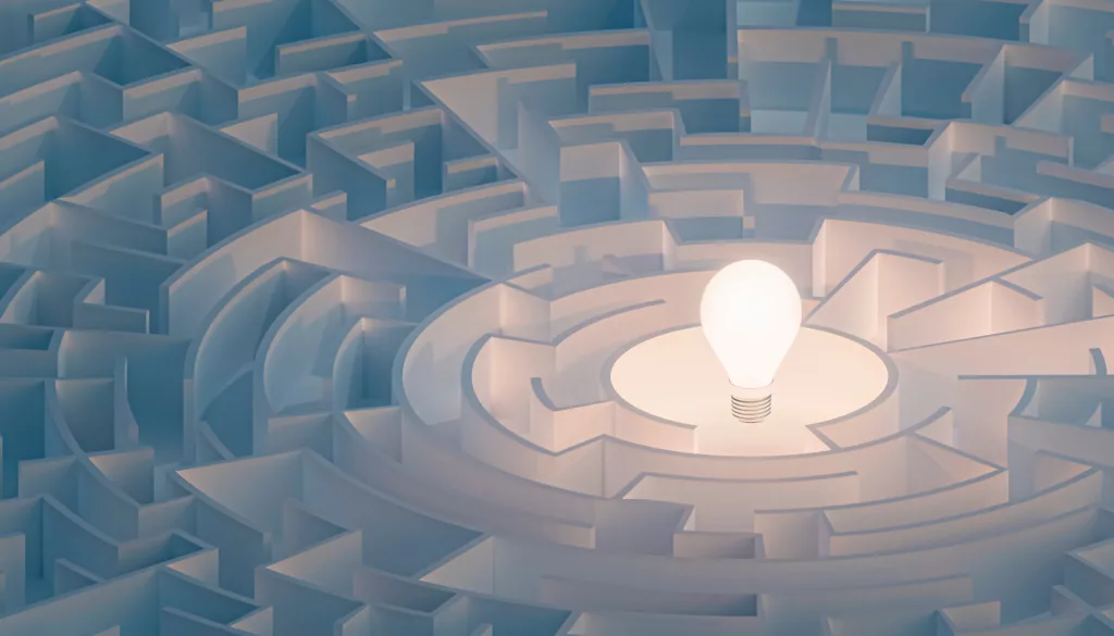 Circular,Maze,Or,Labyrinth,With,Light,Bulb,In,Its,Center. Circular maze or labyrinth with light bulb in the middle